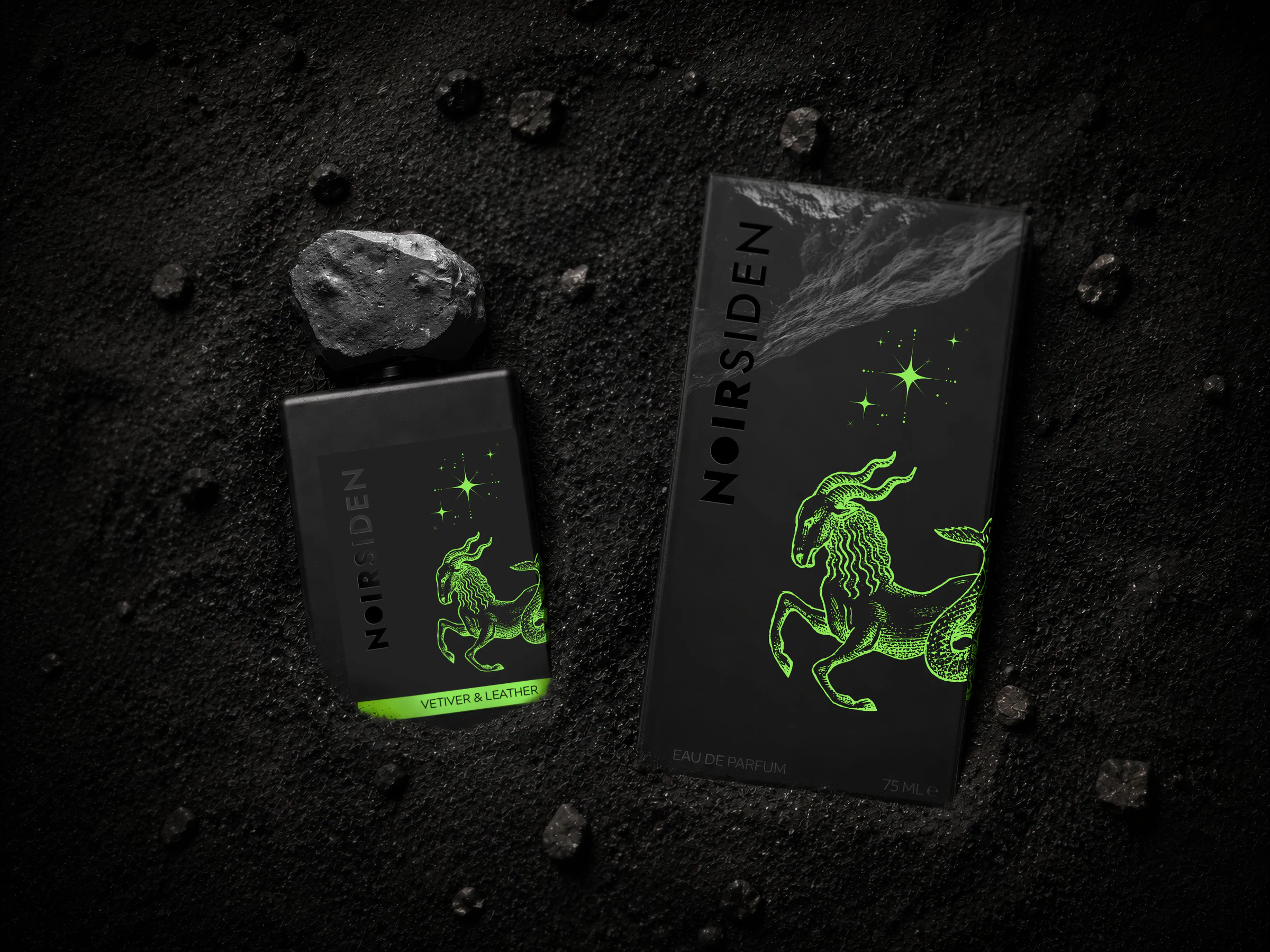 Noirsiden, autorska marka perfum niszowych — flakon z kamienną nakrętką i opakowanie z symbolem zodiaku.